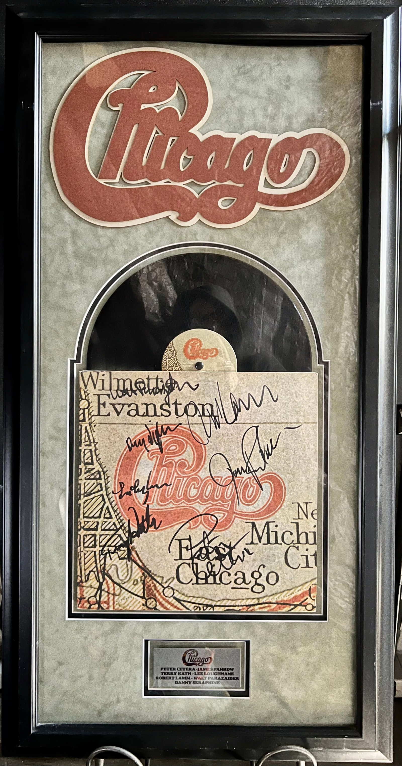 Signed Chicago XI LP Plaque: Signed Chicago XI LP Plaqueis a framed collectible and signed by Peter Cetera, Robert Lamb, Terry Kath, Walter Parazaider, Danny Seraphine, Lee Loughnane and James Pankow. Due to the reflective nature