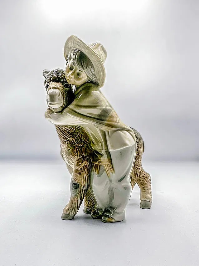 Platero and Marcelino 1971, Lladro: Platero and Marcelino 1971, Lladro Boy hugging donkey Is a glazed porcelain figurine stamped Lladro, Spain. This piece is in excellent condition. Measures 6 x 8 x 4 in.