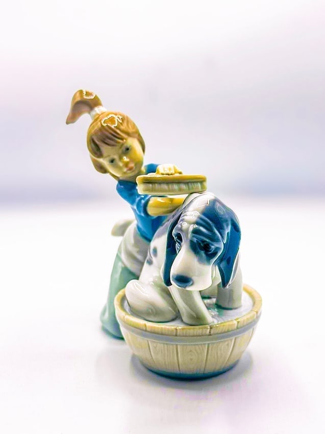 Bashful Bather 1988, Lladro: Bashful Bather 1988, Lladro Is a glazed porcelain figurine stamped Lladro, Spain. This piece is in excellent condition. Measures 5 x 5 x 3 in.