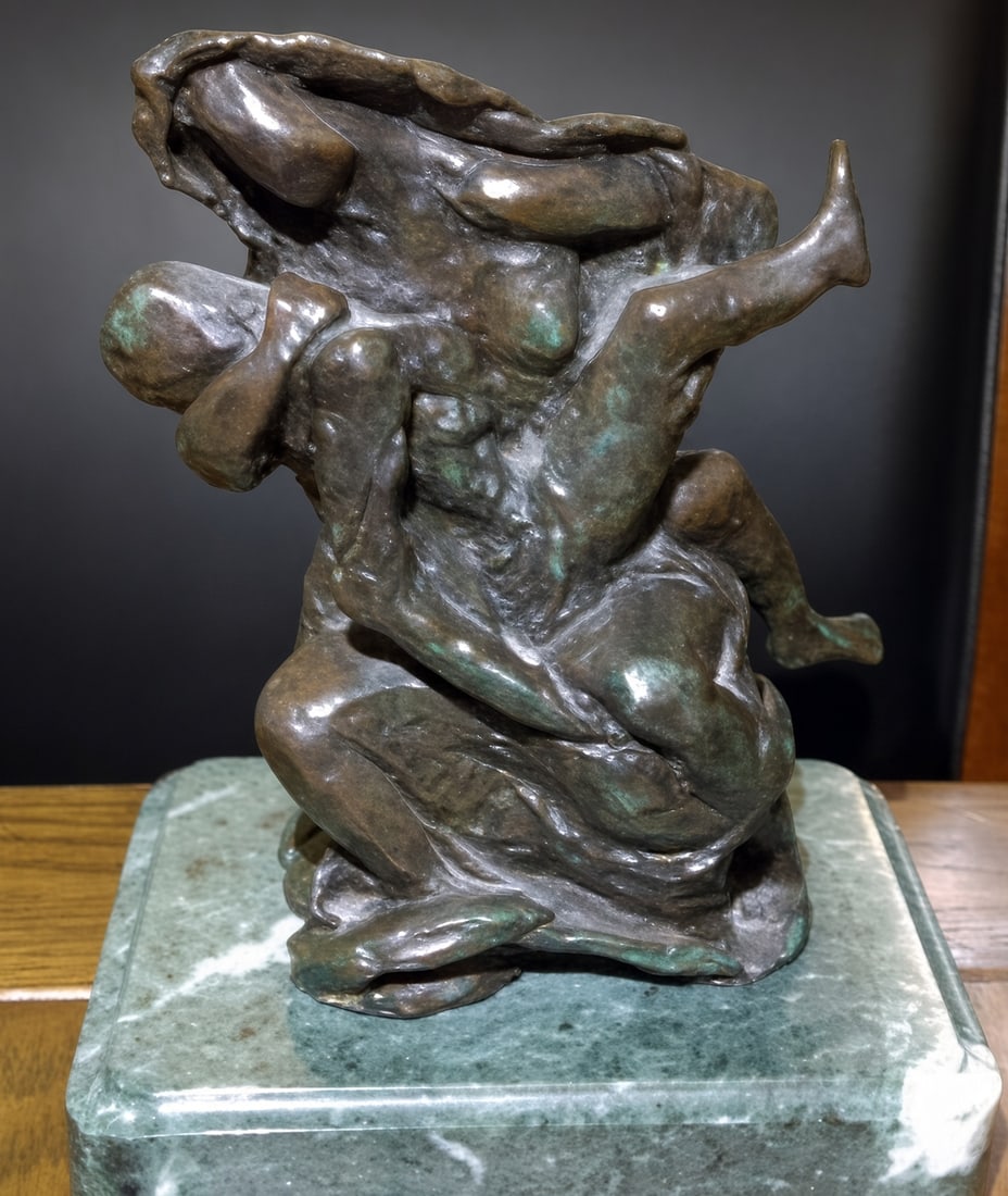 Pietà (Hombre Muerto sobre Mujer), conceived circa 1974: Pietà (Hombre Muerto sobre Mujer), conceived circa 1974Bronze sculpture with brown patina, mounted on a green marble base. A draped female figure cradles a limp, weightless male body — Dalí’s su