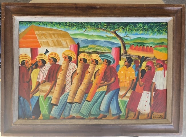 Haitian School (20th C.) Rural Village Celebration with Drummers & Dancers – Ex. Bricston: An energetic, richly populated rural celebration scene rendered in the classic Haitian Naïve tradition. The composition centers on the pulse of communal music, featuring two foreground drummers playi