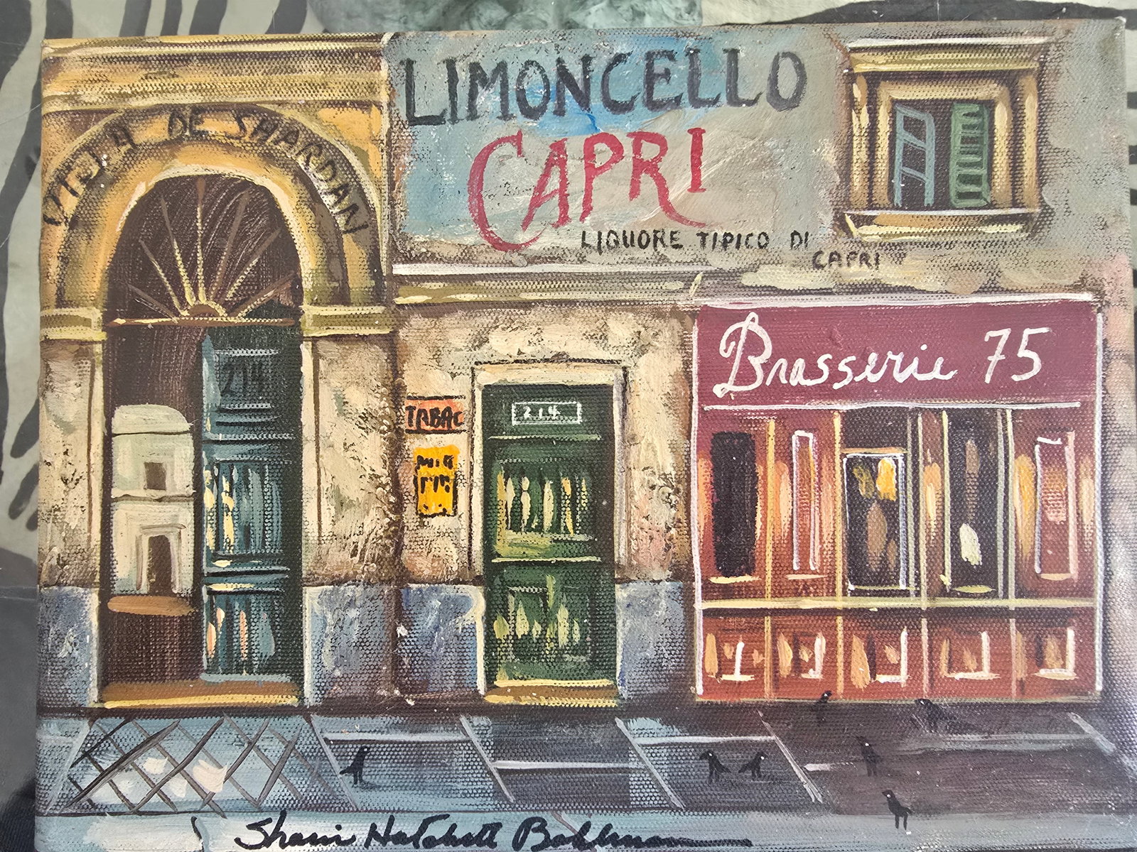 Jewel Box: A vibrant, sun-drenched street scene in Capri with a row of weathered buildings featuring an arched doorway, teal doors and green-shuttered windows, with signage for "Limoncello Capri," "Brasserie