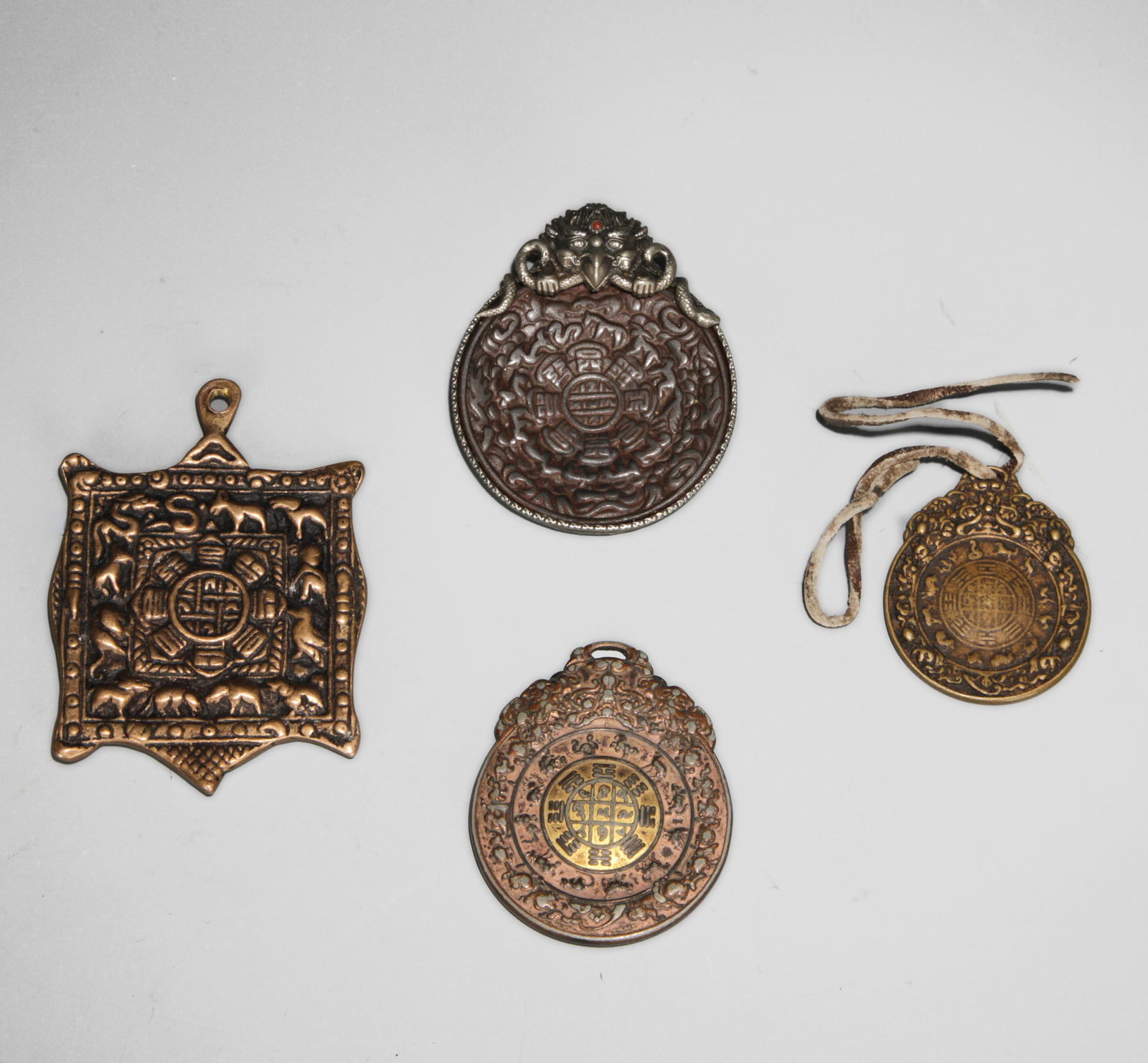 Four Tibetan Amulets (1 of 6)