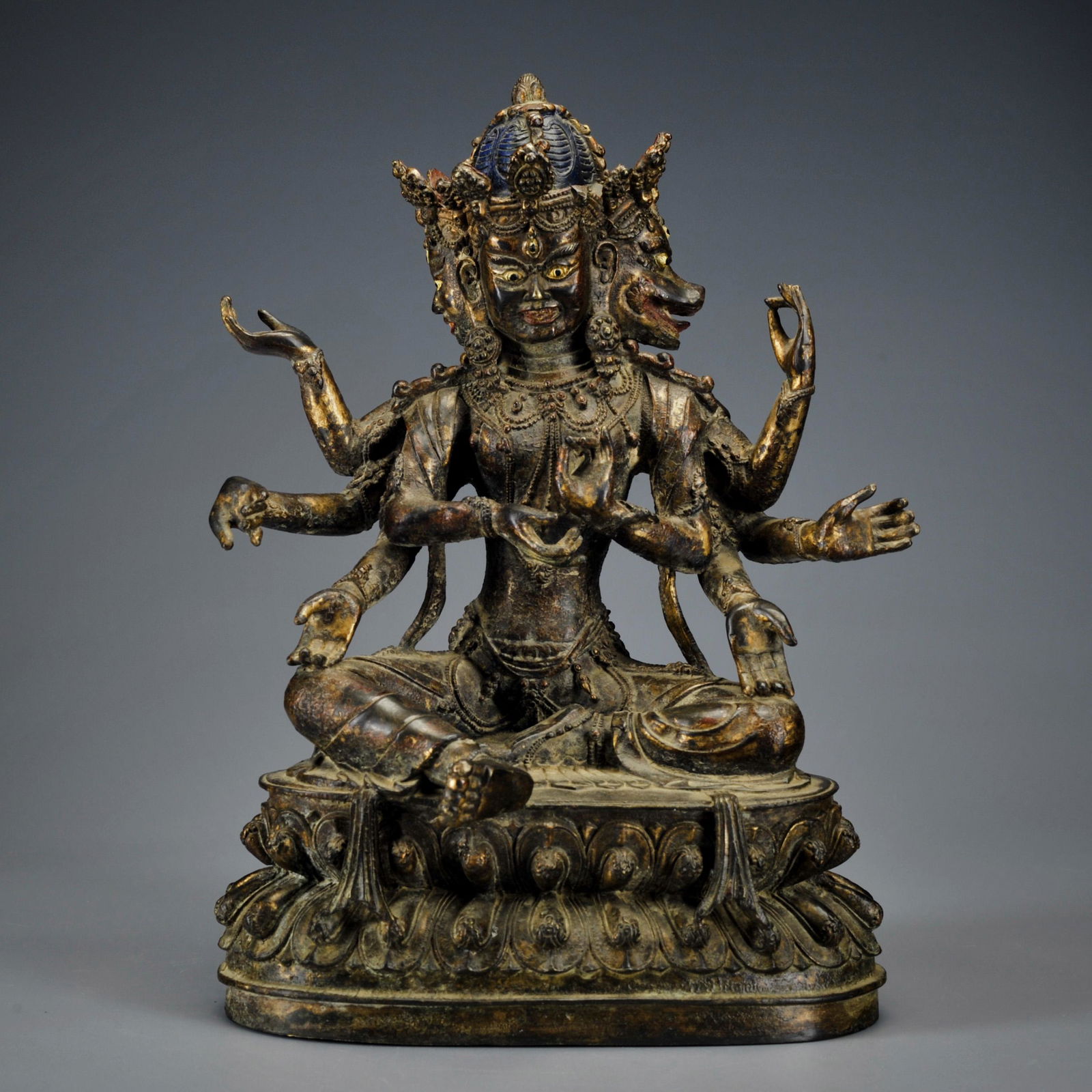 A Tibetan Gilt-Bronze Seated Protector (1 of 11)