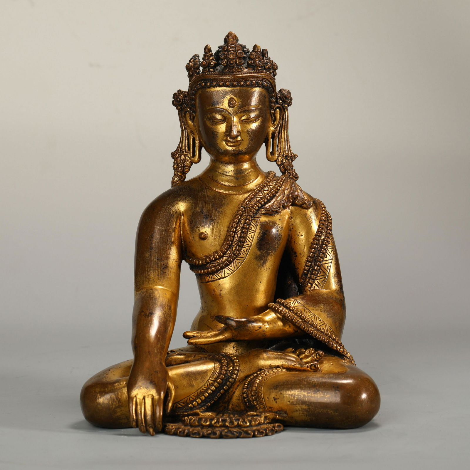 A Tibetan Bronze Gilt Crowned Buddha (1 of 9)