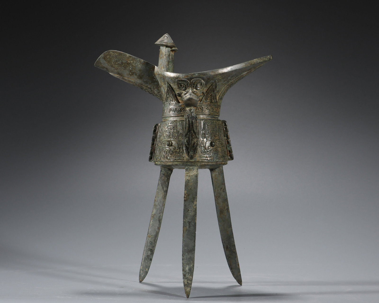 A Bronze Wine Vessel Jue Shang Dyn.: A Bronze Wine Vessel Jue Shang Dyn. H:25cm;W:17.4cm;1.05kg
