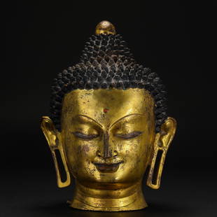 A Tibetan Bronze-gilt Buddha Head: A Tibetan Bronze-gilt Buddha Head H:39cm;L26cm;11.6kg