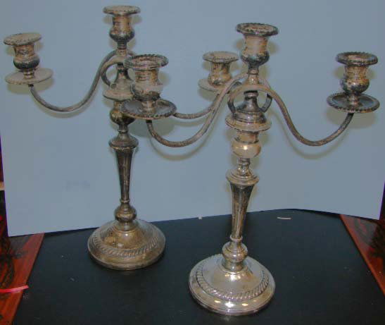 Pair (2) Preisner sterling silver candelabra.: A pair of sterling silver 2 arm candelabra, by Preisner, American, 20th C. Height - 16 inches. each with removable branches, supported on shaped post, with gadroon banded base, drips and bobeches.