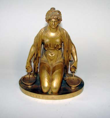 Dore Bronze Kneeing Female. French 19th C.: Height - 6.5 inches. Depiction of a kneeling classical female a jug in each hand pouring into bowls. The rim of the base is stamped "VII". Condition: two holes in back.