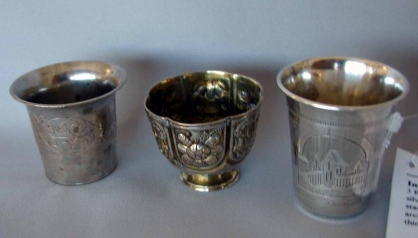 3 Russian Silver Kiddish Cup, I. Zakarov: Russian silver kiddish cup hallmarked "84" " 1880, with the maker stamp Ivan Zakaov, Moskow, 1856 - 1896. H - 2", architectural reserves, one cup hallmarked "84" and a third of unknown origins or meta