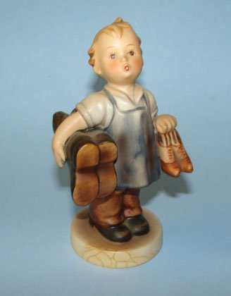 Hummel figurine "Boots", 143/0, full bee.: Height - 5.25 inches. bearing the full high bee in incised circle, trademark # 2, circa 1956 - 1959. Impressed 143/0, 71, stamped "Germany" in black. Condition: crazing on base.