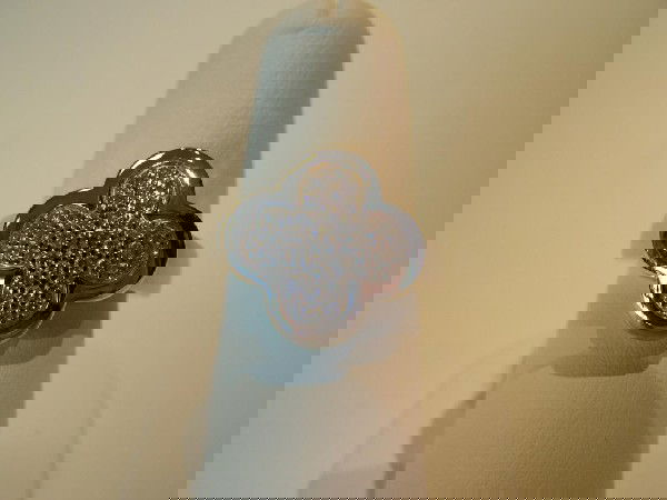 Van Cleef & Arpels 18K White Gold Alhambra Ring.: Van Cleef & Arpels 18K White Gold Alhambra Ring. Top of ring is clover shaped and pave set with round brilliant diamonds in the center. Diamonds weigh a total of 0.50 carat. Top of ring measures L-0.6