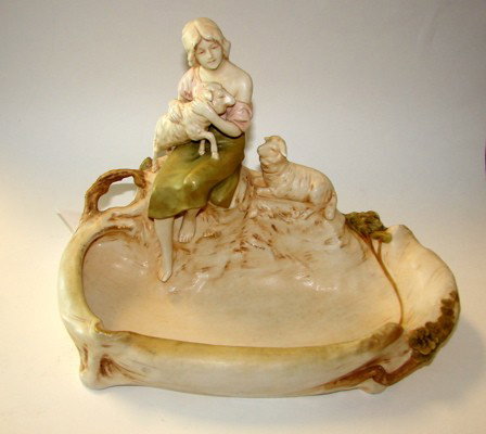 Royal Dux Porcelain Art Nouveau Bowl.: Bearing the Royal Dux raised Hallmark, (C. 1900 - 1918) H - 9, L - 12", a free form bowl with a Sheperdess and sheep."