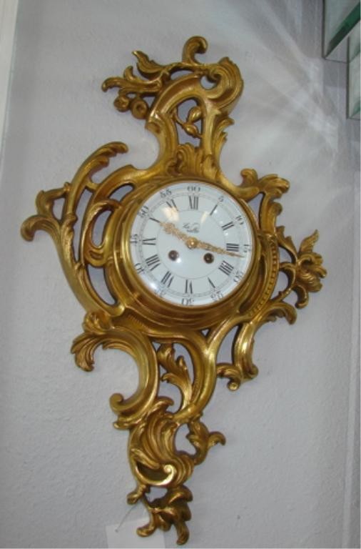 Louis XV style Dore Bronze Cartel Clock. La Vallee: Height - 21, in the Rococo manner, nice detail bronze casting, the enamel face with fillagree arms, time and strike, signed on the dial, "LaVallee"."