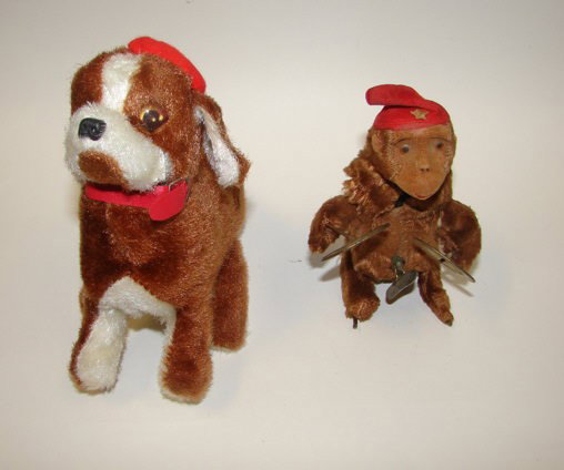 Group of two (2) wind up toys, dog and monkey.: The monkey with cymbals, is similar to the one featured in the film classic with James Dean, "Rebel Without a Cause". Both worn but in working order.