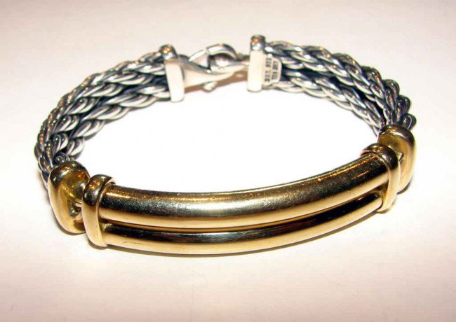 18K y/ gold sterling silver ID bracelet D. Yurman.: 18K yellow gold / sterling silver cable ID bracelet. David Yurman.Three sections, the center section of 18K gold. 56.9 grams total weight.