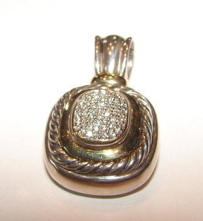 Silver & 18K gold, diamond enhancer. Yurman.: Silver & 18K yellow gold, and diamond accents enhancer. David Yurman.51 round brilliant cut diamonds pave set at center. .51 carat total weight. H- I color VS clarity. 19.8 grams total weight.