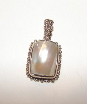 SIlver mother-of-pearl enhancer pendant Dweck.: Silver mother-of-pearl enhancer pendant. Stephen Dweck.22.3 grams total weight.