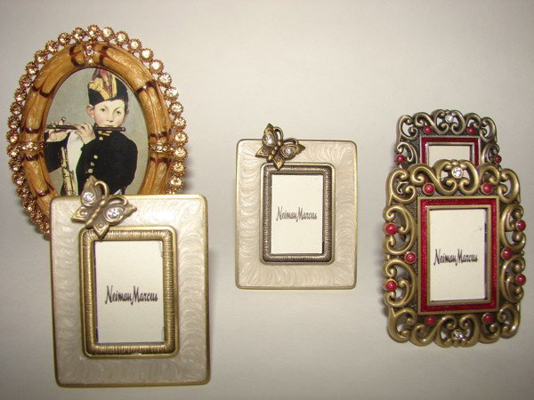 Seven (7) Jay Strongwater enameled picture frames.: Jay Strongwater enameled and jeweled oval form table top picture frame. H - 3.5". Easel back with Strongwater label. Group of six small picture frames, Jay Strongwater. 2.25" X 1.75" each, enameled de