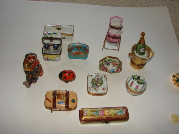 Lot of 12 Limoges Porcelain pill/trinket boxes.: With unusual themes. All marked "Limoges"