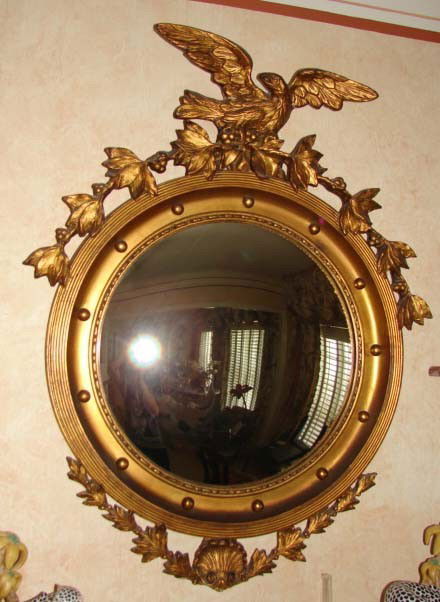 Federal style bull's eye mirror.: Federal style bull"s eye mirror. Custom 20th C. reproduction.Eagle pediment with pierced laurel leaf and berry trailing garland and base, applied ball molding. H - 34", W - 27". Diamter of bulls eye g