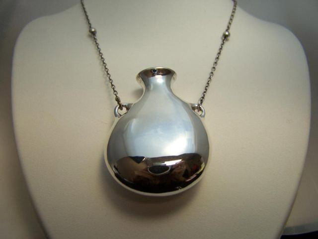 Sterling. Tiffany & Co. Elsa Peretti pendant.: AWN1888: Sterling Silver. Tiffany & Co. Elsa Peretti Bottle Pendant. Cable Chain with SS balls 3.5". 29" chain. Gross weight 23.2 grams