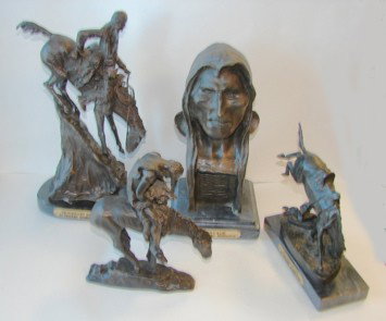 Group of four Western theme sculptures, Remington,: Including Remmington', "Mountain Man" H - 14", "Wicket Pony" H - 8 /2", "Savage" H - 12", and "End of the Trail" by Fraiser, (composition construction) All heights include the bases.
