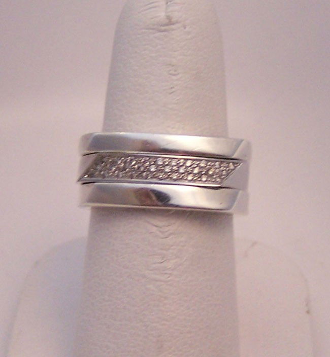 SS/18K White Gold Diamond Gehry Ring.: SS/18K white gold diamond Gehry rings. Three stackable freeform bands stamped Tiffany & Co containing 0.20 carat in diamonds Pave set diamond set across top of white gold band. Rings retails for $2,00