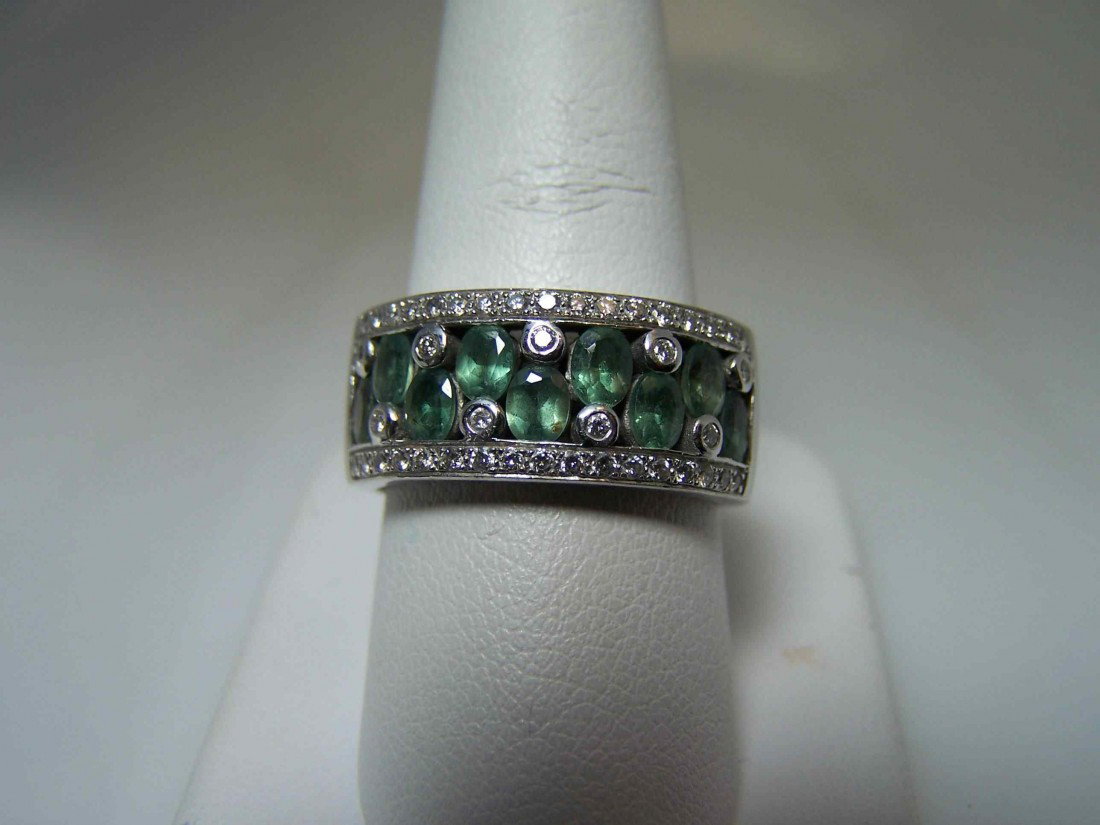 14K w/gold Alexandrite fashion band by LeVian.: 14K white gold, alexandrite, & 0.35 ctw diamond fashion band by LeVian. Center of band holds 9 recessed oval shaped alexandrites staggered between bezel set melee. Edges of band hold bead-set melee. G