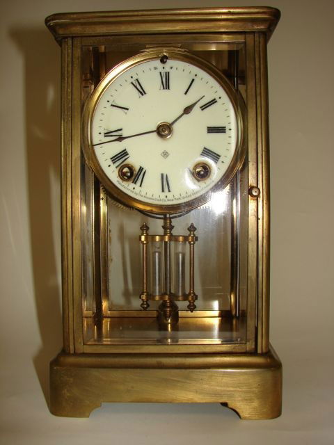 Ansonia Crystal Regulator Clock.: H - 10.75 inches. The Face with the Ansonia monogram, also noted on the bottom,"Manufactured by the Ansonia Clock Co. New York, United States of America. Pundulum driven for time and strike, Roman num
