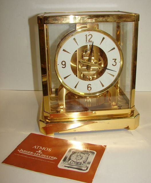 LeCoultre Atmos Clock.: Having a brass case, numbered movement.