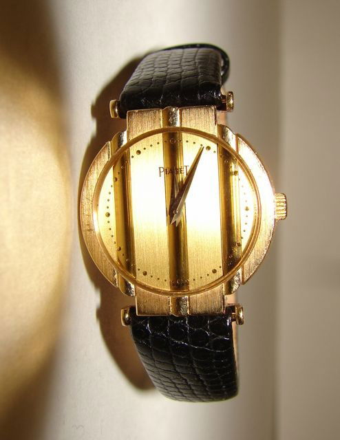 Piaget 18K Yellow Gold Ladies Dress Watch.: With strap, quartz movement, striped face.