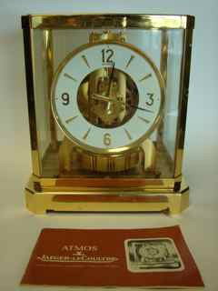 LeCoultre Atmos Clock.: Having a brass case, numbered movement.