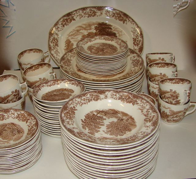 74 Piece Royal Tudor China "Old England".: Comprising 15 dinner plates, 13 cups, 16 saucers, 16 soup bowls, 15 dessert bowls, 13 salad plates, 2 large serving platters, and 1 open entree bowl. Some discoloration on cups.