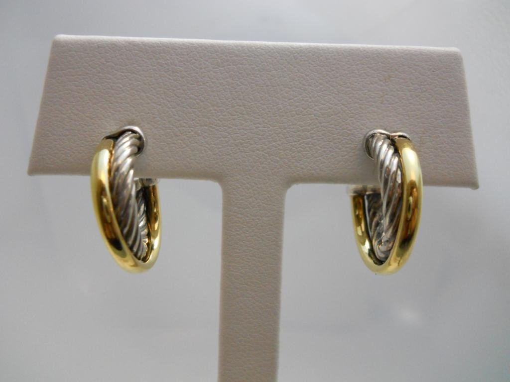 David Yurman Sterling Silver Earrings.: 18K yellow gold and sterling silver David Yurman earrings. Silver rope hoop with a gold smooth hoop cross over. The earrings have sterling silver tension backs and weigh 6.9 grams. AWE2533. All jewelr