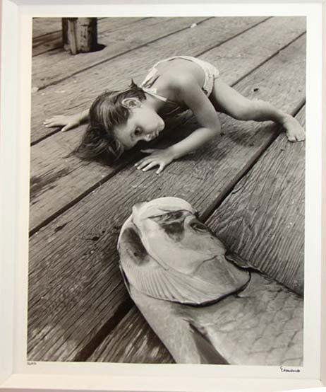 ALFRED EISENSTAEDT (1898-1995) GIRL W/FISH: Alfred Eisenstaedt (German/American, 1898 - 1995). H - 16, W - 11" (plate size). Black and white photo. Signed lower right corner, Eisenstaedt. Edition 32/250. Glazed, mounted and framed.