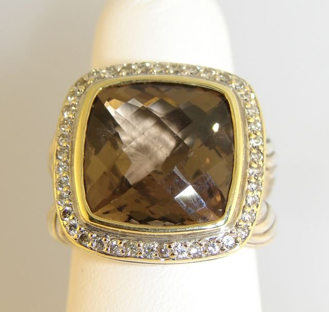 David Yurman Sterling & 18K Gold Citrine Ring.: 16.3 grams total weight, size 7. A cushion cut smoky citrine stone with brilliant round cut diamond bezel. Hallmarked DY, 925, 750". [32]