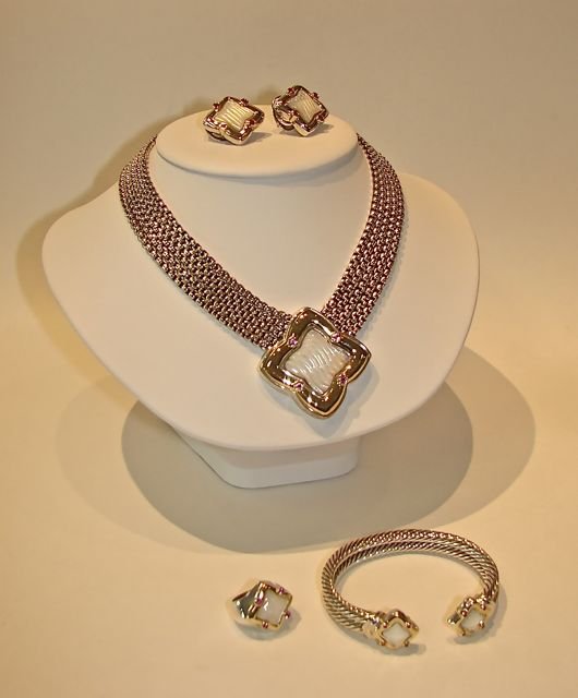 Four Piece David Yurman Sterling Fashion Set.: Comprising a necklace with five chains and pendant, a ring, a pair of earrings and a bangle bracelet. Each adored with carved mother of pearl, bezel set red stones and 18K gold accents. The earrings a