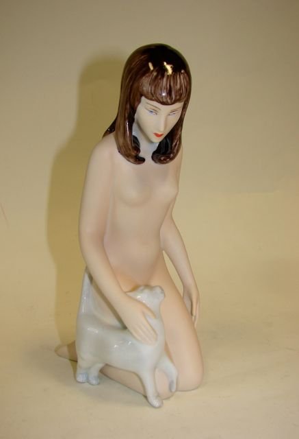 Royal Dux Porcelain Figurine. Female Nude W/ Cat.: Height - 9, bearing the Royal Dux raised pink hallmark, impressed 21038, with the original foil label."