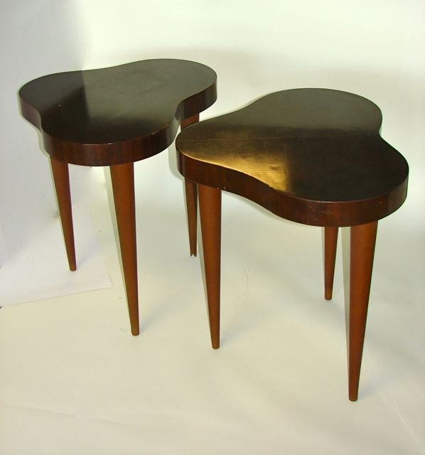 Pair (2) Gilbert Rohde "Biomorphic Cloud" Tables.: Made for Herman Miller, stencil number "4187". Burl wood and leather clad tapered legs. H - 27", D - 27". Condition - some minor scratching on the sides, the tops with minor chips.