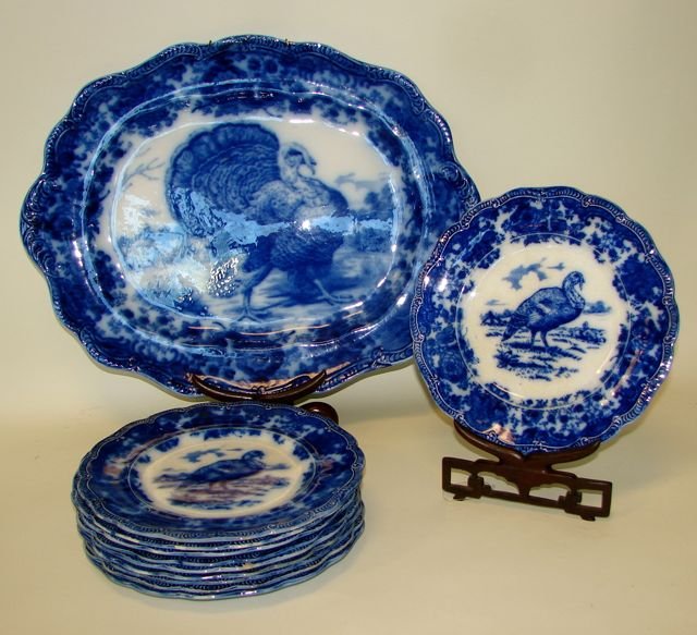 English Flow Blue Porcelain 10 Plates & Platter.: Ridgeways, England. C. 1900. (Kovel 28k) platter L - 15.5", D - 19.5", the plates D - 10". Condition: small chip on back of one plate and small chip on the front side of another. Platter has no appare