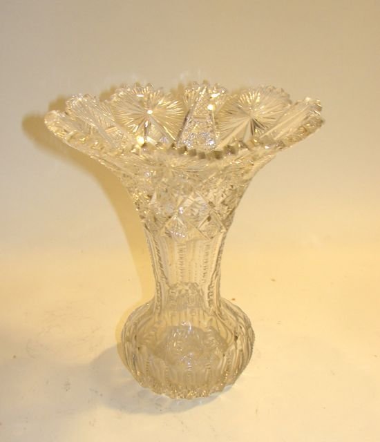 American Brilliant Cut Glass Vase. 1875 - 1915.: H - 11". Flared neck and with bulbous base. Condition; very minor chips on the outer tip edges of the sawtooth rim, (too small to photograph).