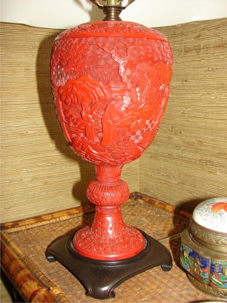 Chinese Cinnabar Urn Form Table Lamp.: Height of vase is 10", 24", including shade, finial and carved base. Very good condition.
