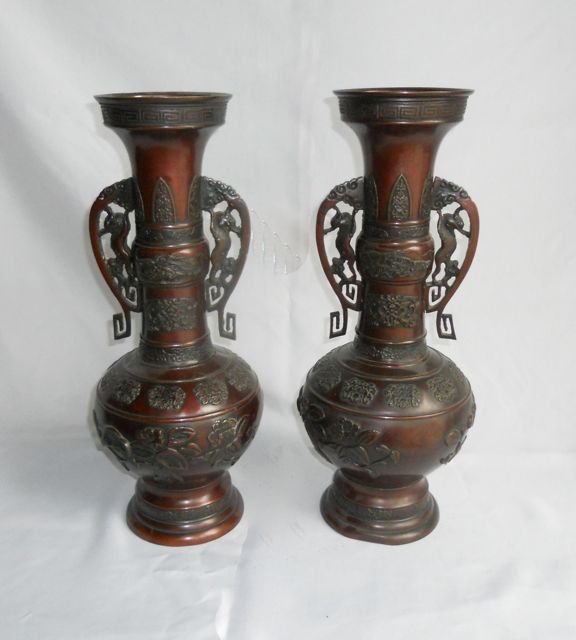 Pair (2) Chinese Bronze Vases.: Double gourd form with handles, and raised relief decor. Labeled on the base. By James Bourlet. Height - 18 inches.
