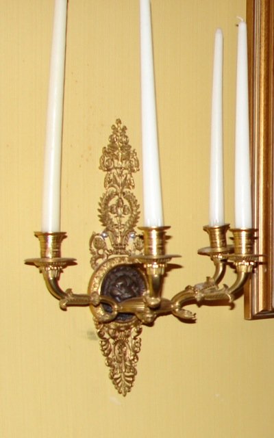 Pair Antique French Empire 4 Arm Wall Scones.: The sconces each with four arms, ebonized bronze lion head and wreathed back plates. Height - 16 inches.