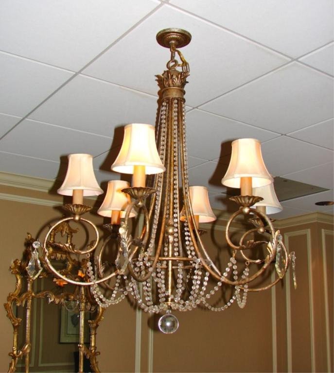 Six Arm Brass Framed Chandelier.: Having six candle arms with fabric shades, bead enhanced brass armature. Due to renovations,these light fixtures may not be immediately available, but will be no later than November 22, 2013.