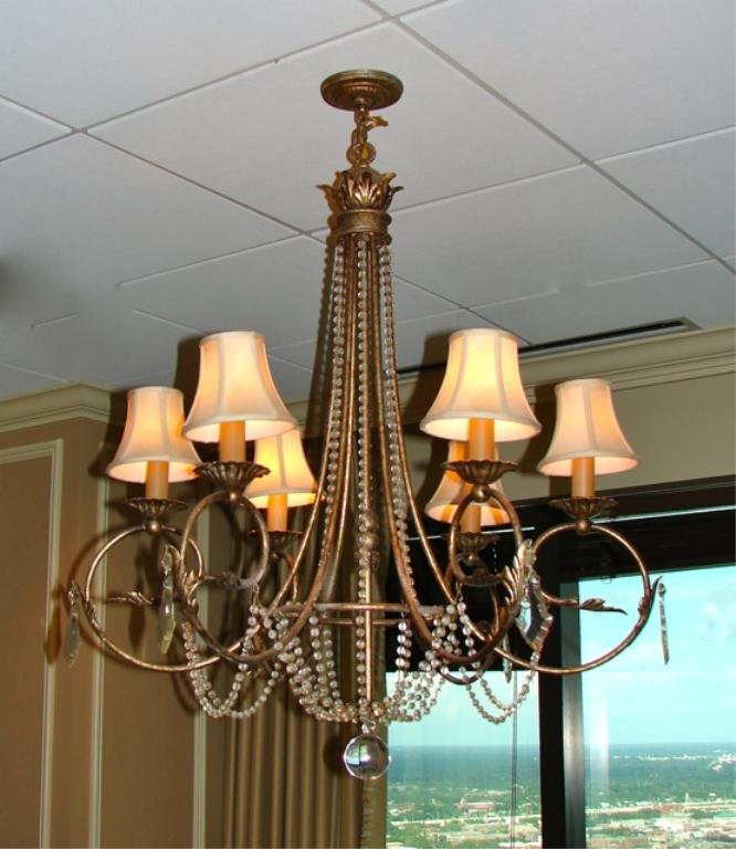 Six arm Brass Framed Chandelier.: Having six candle arms with fabric shades, bead enhanced brass armature. Due to renovations,these light fixtures may not be immediately available, but will be no later than November 22, 2013.