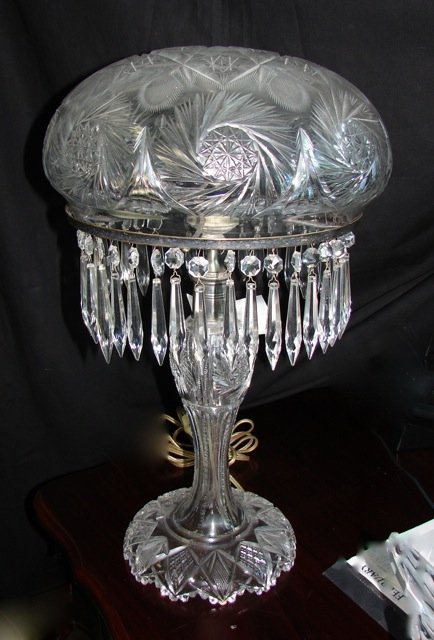 Cut Glass Dome Shade Table Lamp.: Height 20 inches. There are two lights the switch is on the cord. hung with spear prisms.