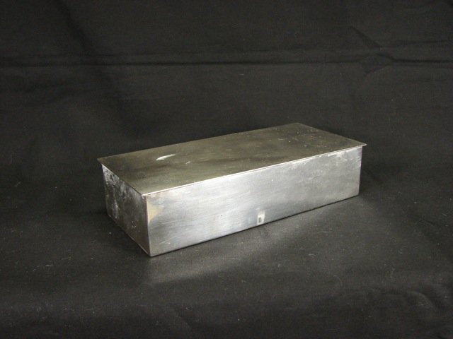 Tiffany & Co. Sterling Silver Cigarette Box.: With the Tiffany & Co. hallmark. Lined with wood. 20 troy ounces, inclusive. 1.75 x 7.75 x 3.50 inches.