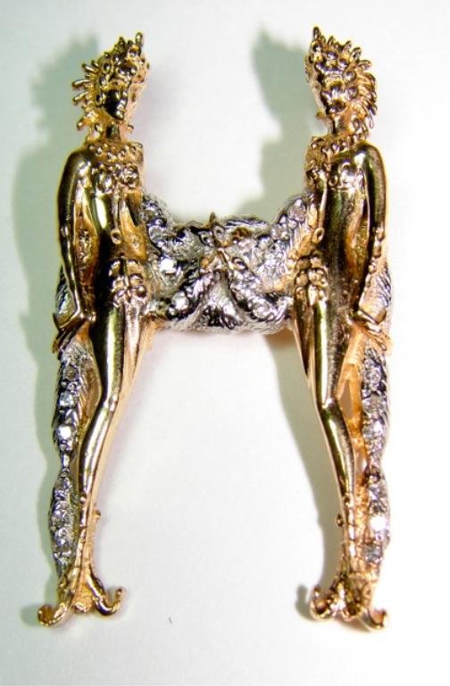 14K Yellow Gold Diamond Erte Initial Pin/Pendant.: Signed Erte, copyright CFA, hallmarked 14K, two Art Deco ladies posed in an H" form, fitted for a pendant or pin. 1.60 x 1.0 inches. 8.1 grams total weight.
